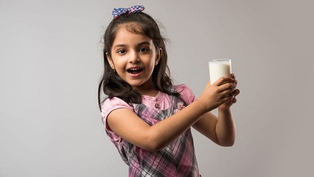 Kid drinking Milk.